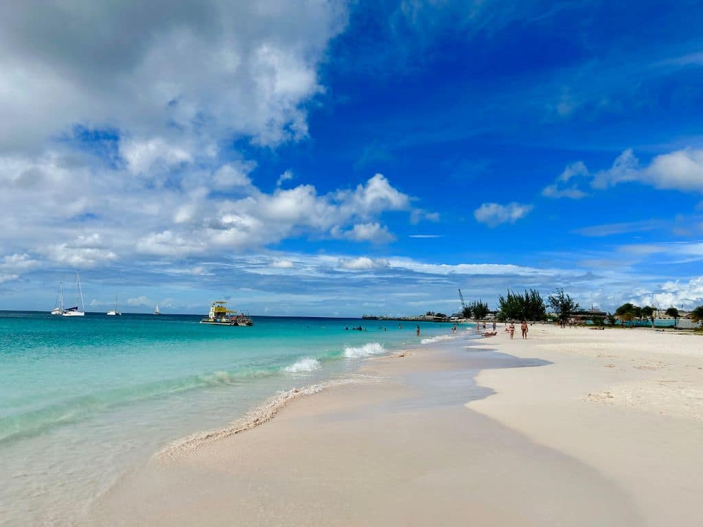 Calm, clear blue water touching a white sand beach at Carlisle Bay Barbados