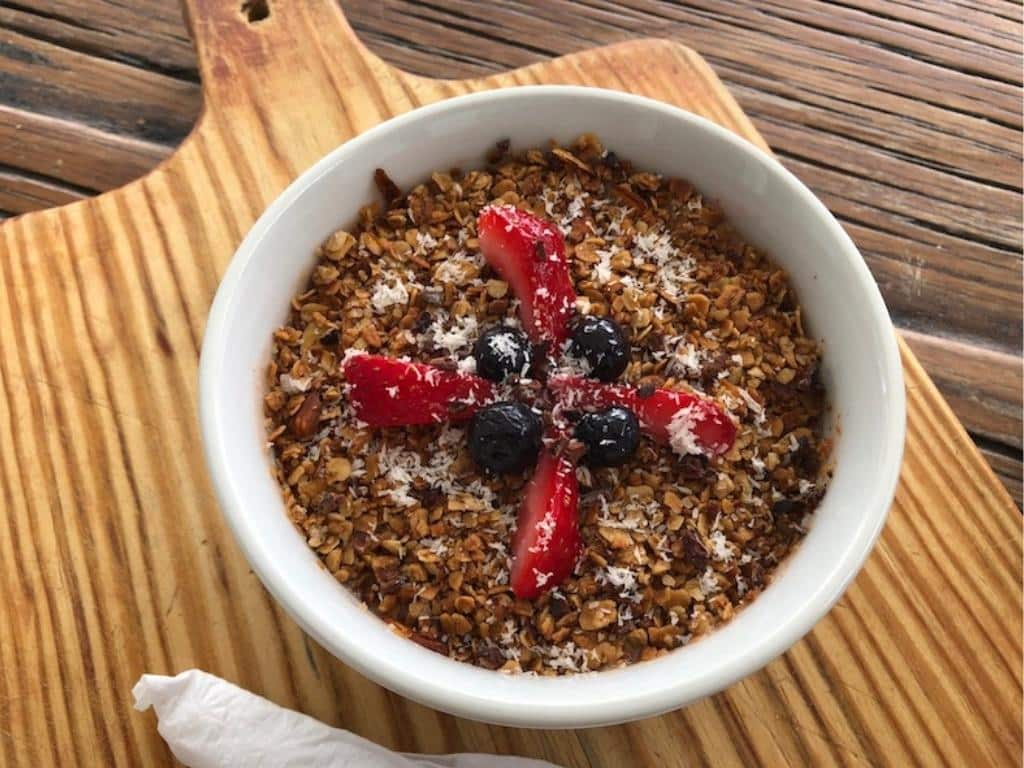 A yogurt bowl with granola and fruit from Art Splash Cafe, one of the best places for breakfast in Barbados
